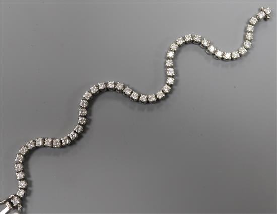 An 18ct white gold and diamond line bracelet, set with forty eight round cut stones, 18.5cm.